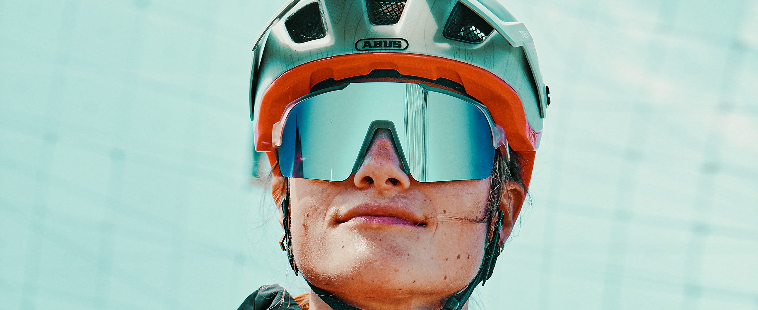 Cyclist with helmet and large sports sunglasses with a serious look after the ride